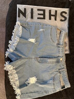 SHEIN Light Blue Ripped High-Rise Frayed Hem Denim Shorts